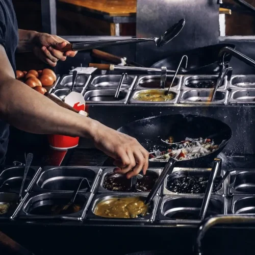 cooking-process-asian-restaurant-cook-is-fry-vegetables-with-spices-sauce-wok_613910-4975 (1)